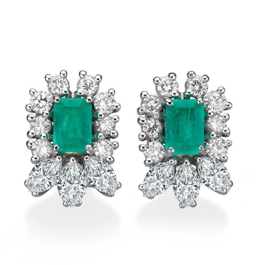 Gold earrings set with emeralds and diamonds