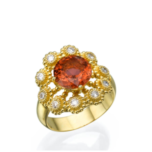 A gold ring set with tourmaline and diamonds